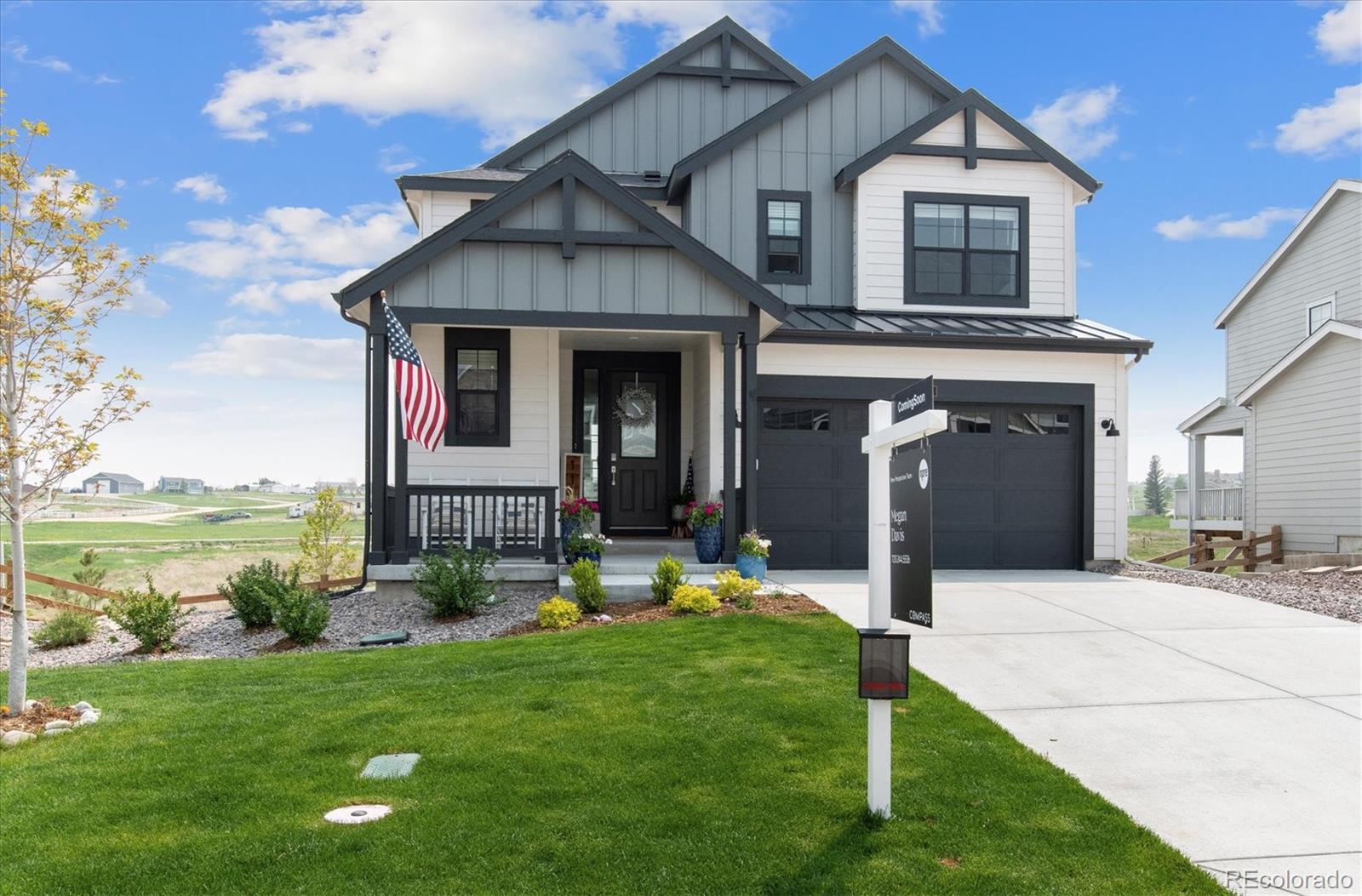 1142 Williams Loop Elizabeth, CO 80107 - Photo 2 of 38 a front view of a house with a yard and garage