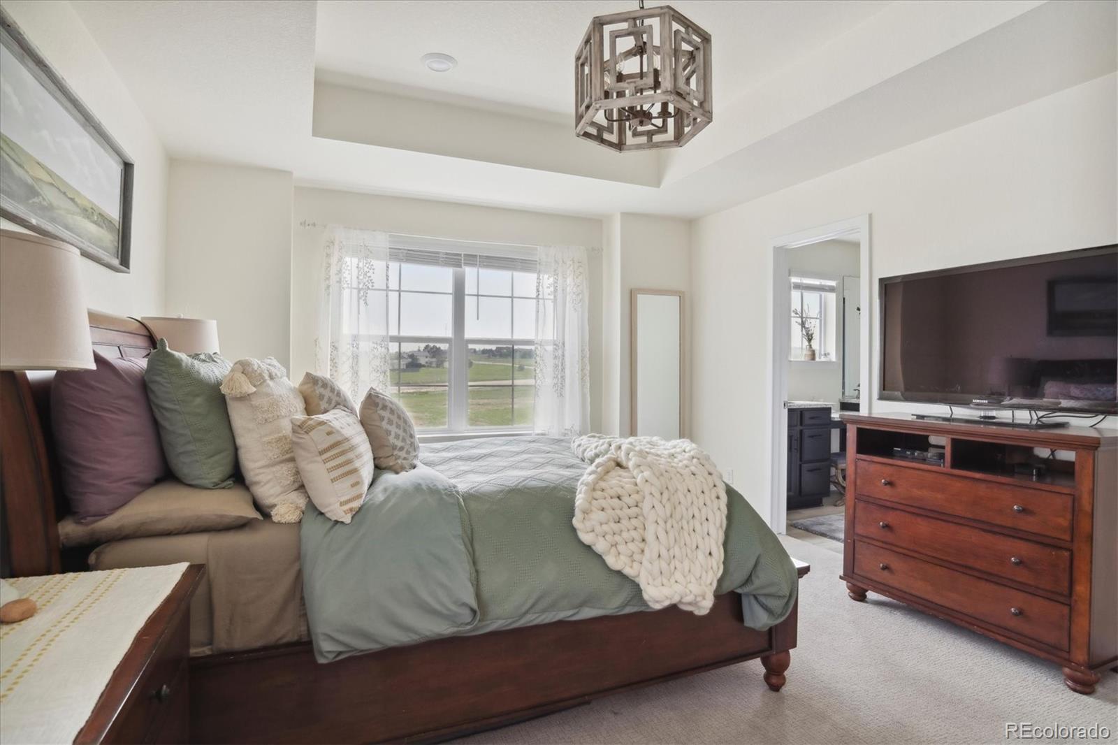 1142 Williams Loop Elizabeth, CO 80107 - Photo 21 of 38 a living room with furniture and a flat screen tv