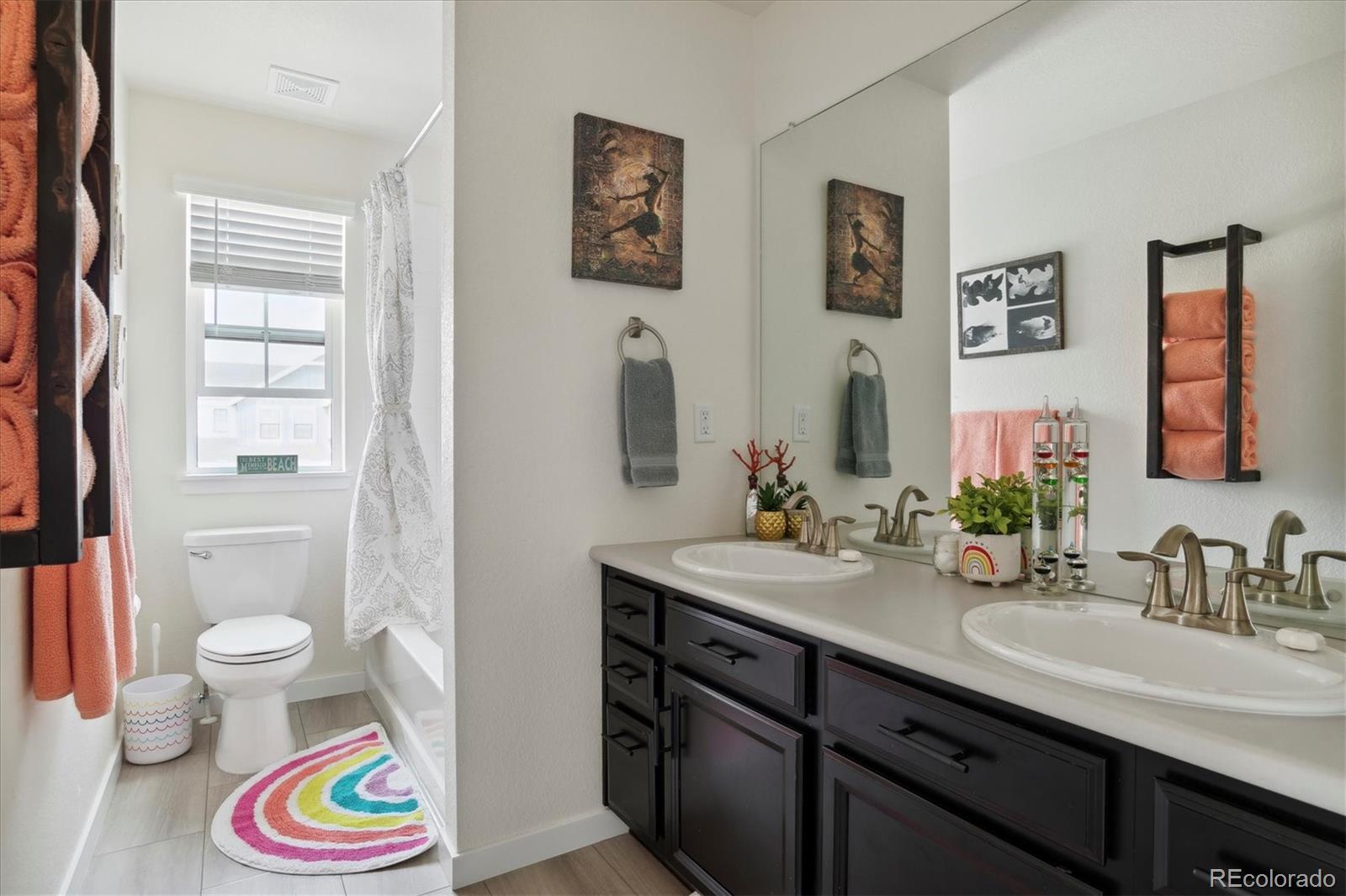 1142 Williams Loop Elizabeth, CO 80107 - Photo 23 of 38 a bathroom with a sink vanity and a mirror
