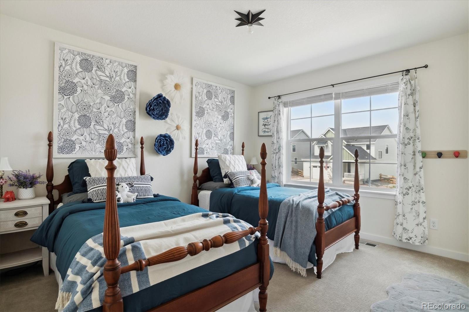 1142 Williams Loop Elizabeth, CO 80107 - Photo 24 of 38 a bedroom with two beds and a window