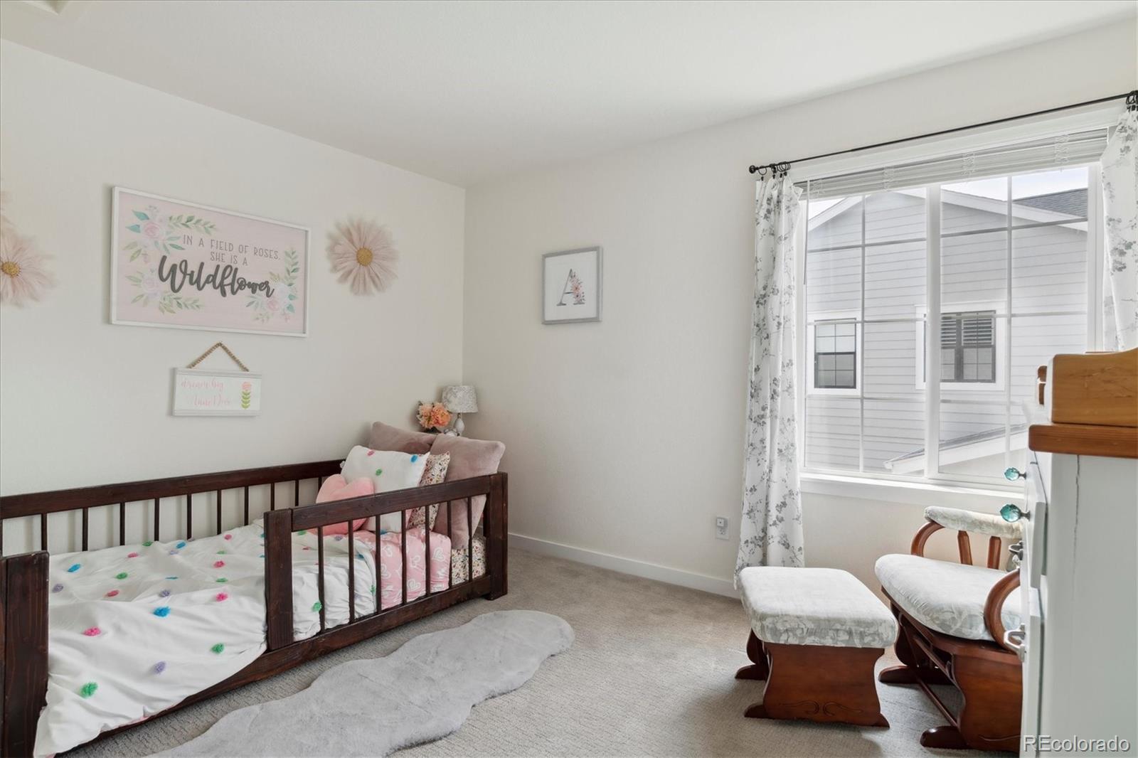 1142 Williams Loop Elizabeth, CO 80107 - Photo 25 of 38 a bedroom with furniture and a window