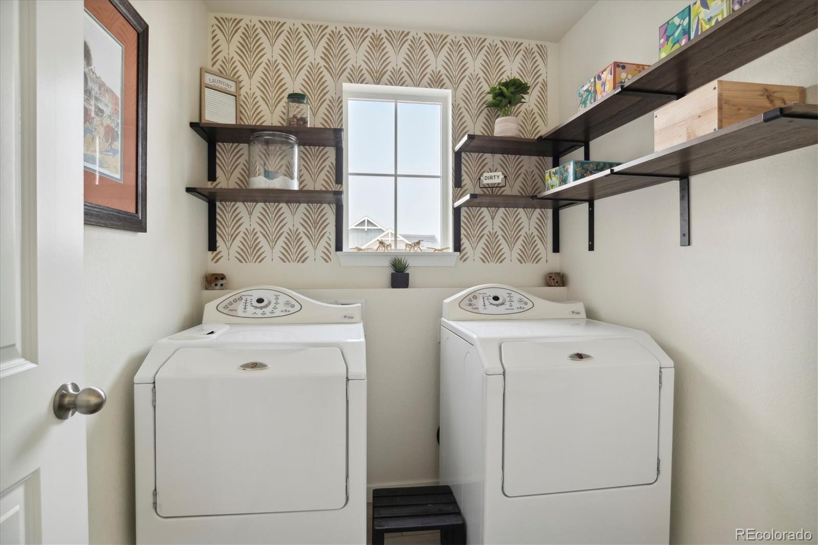 1142 Williams Loop Elizabeth, CO 80107 - Photo 26 of 38 a utility room with dryer and washer