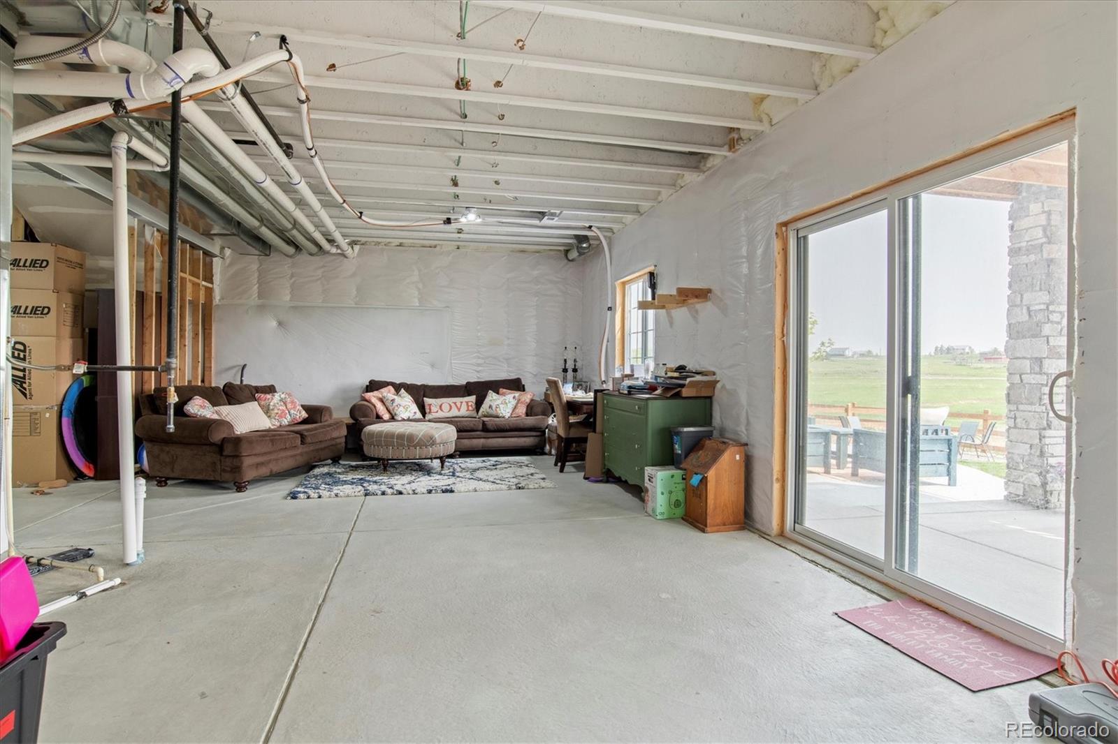 1142 Williams Loop Elizabeth, CO 80107 - Photo 28 of 38 a living room with furniture