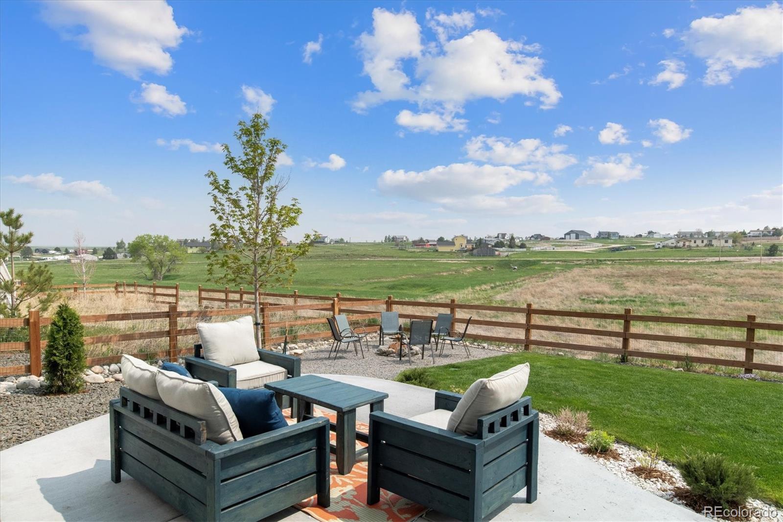 1142 Williams Loop Elizabeth, CO 80107 - Photo 29 of 38 a view of a patio with couches and potted plants