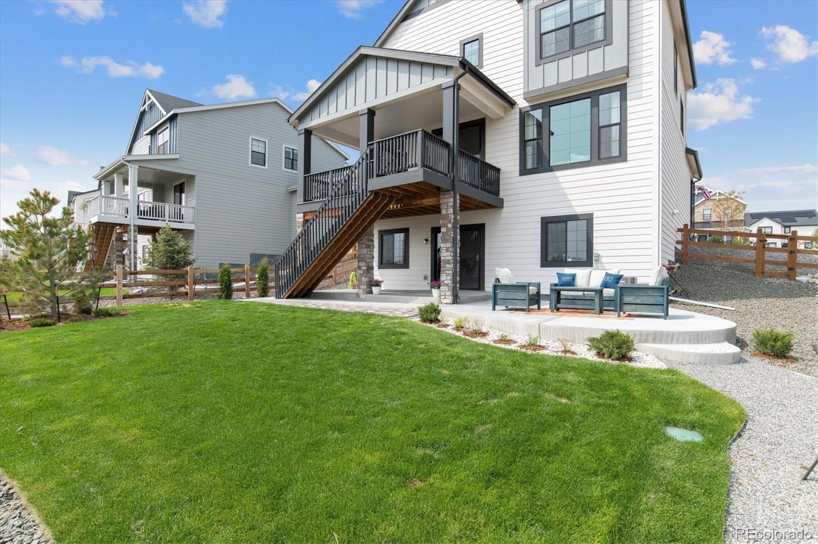 1142 Williams Loop Elizabeth, CO 80107 - Photo 35 of 38 a front view of a house with a yard table and chairs