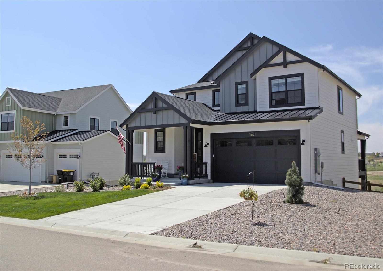 1142 Williams Loop Elizabeth, CO 80107 - Photo 38 of 38 a front view of a house with a yard and garage
