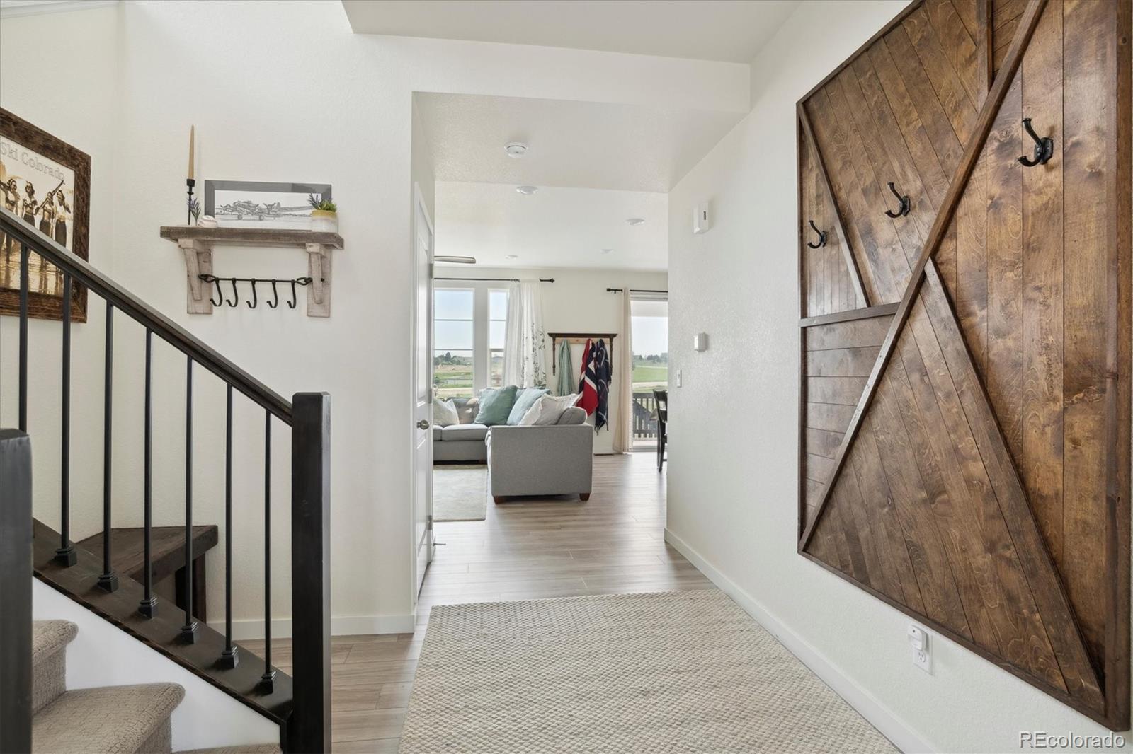 1142 Williams Loop Elizabeth, CO 80107 - Photo 7 of 38 a view of a hallway view with staircase and living room