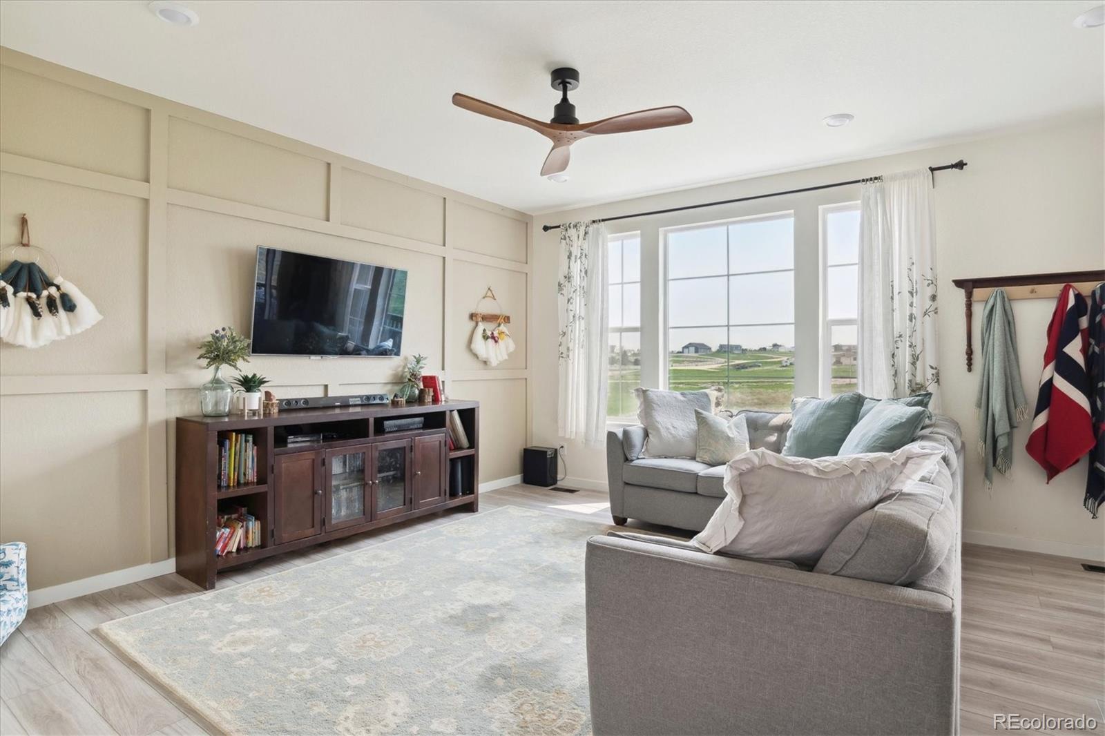 1142 Williams Loop Elizabeth, CO 80107 - Photo 8 of 38 a living room with furniture and a flat screen tv
