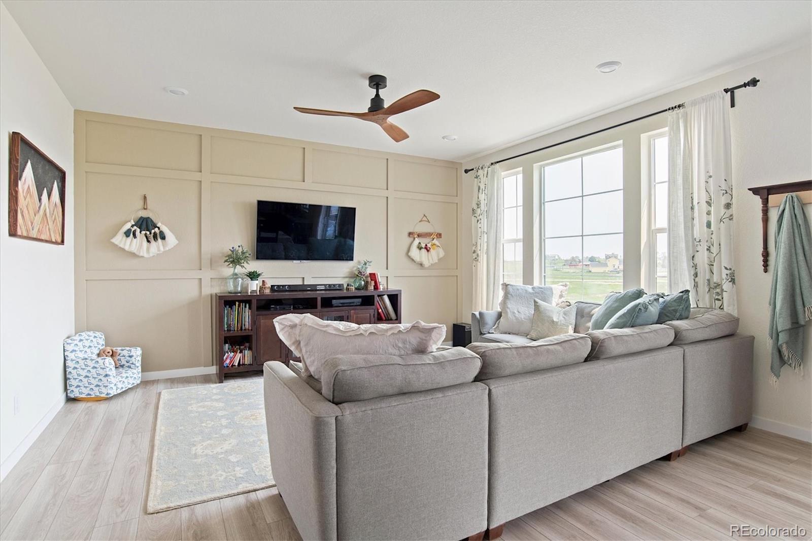 1142 Williams Loop Elizabeth, CO 80107 - Photo 9 of 38 a living room with furniture and a flat screen tv