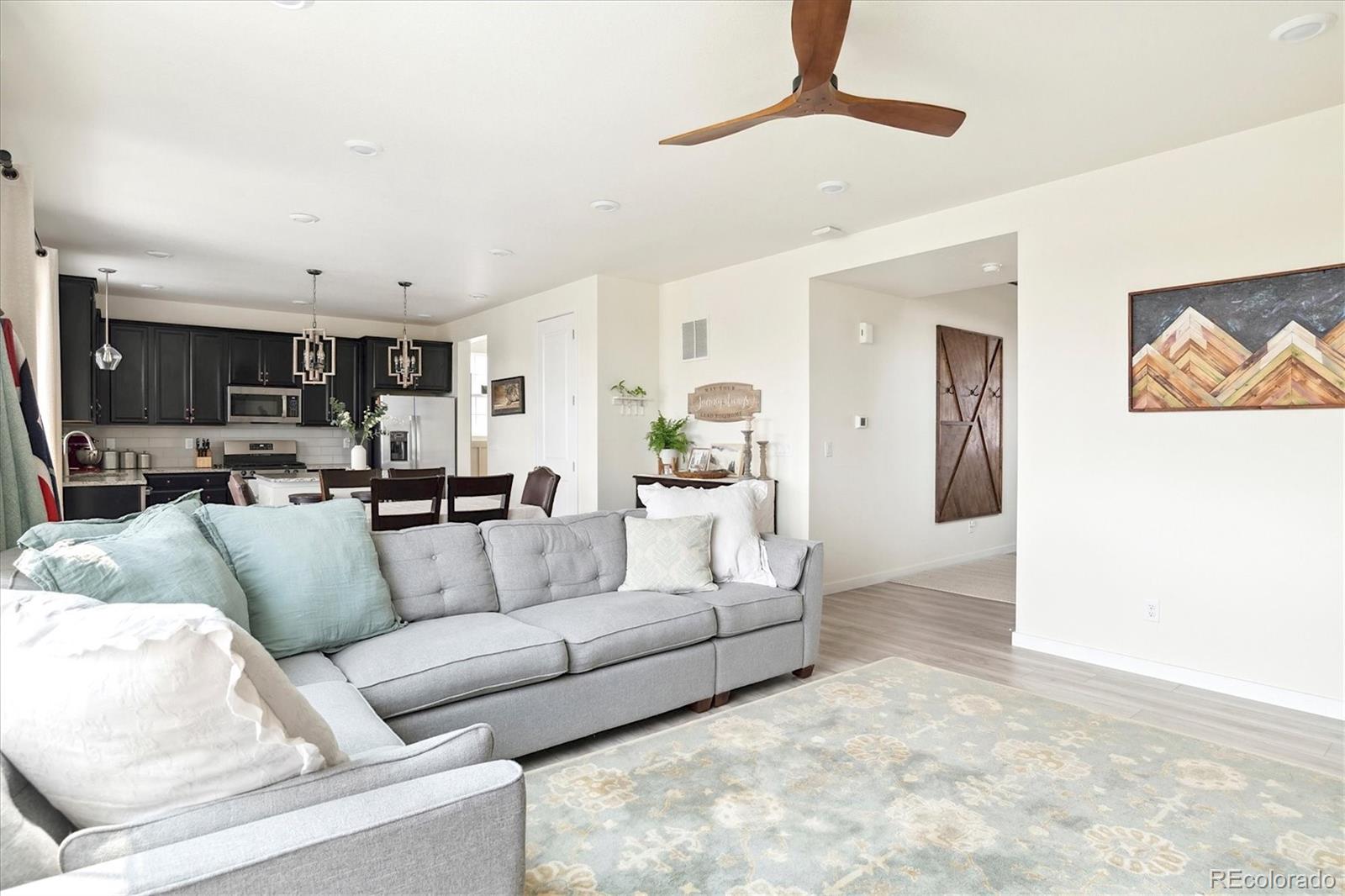 1142 Williams Loop Elizabeth, CO 80107 - Photo 10 of 38 a living room with furniture and a view of kitchen