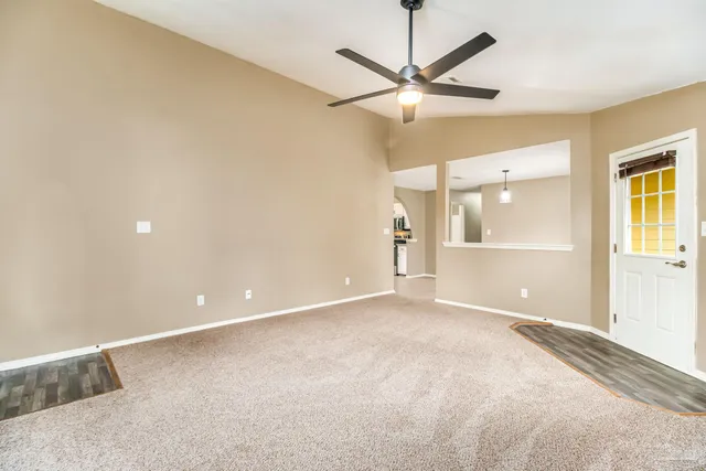 a view of an empty room and window