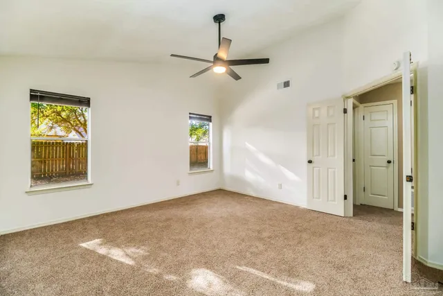 a view of a house with yard and a garden