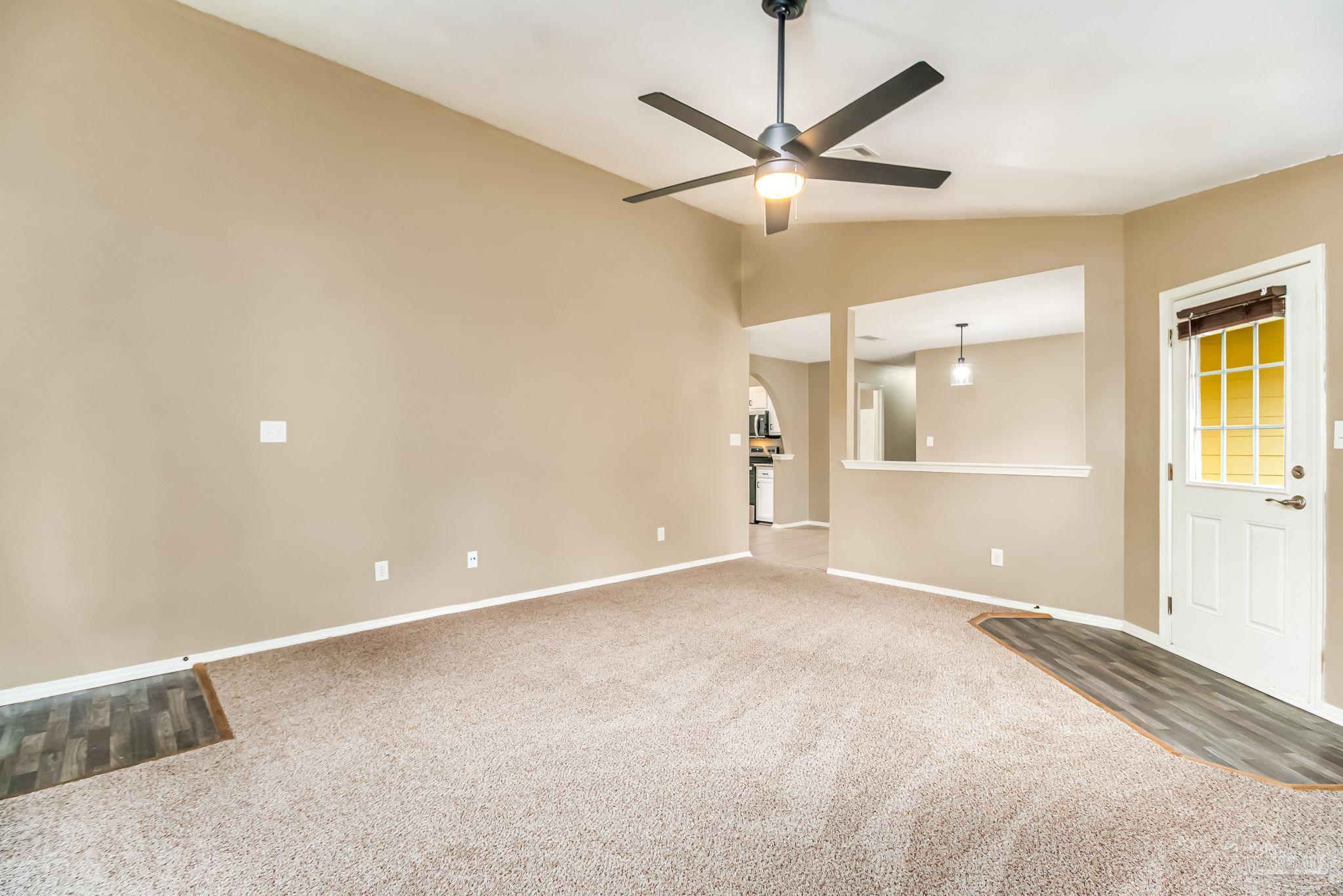 4554 Northpointe Place Pensacola, FL 32514 - Photo 23 of 42 an empty room with fan and a ceiling fan
