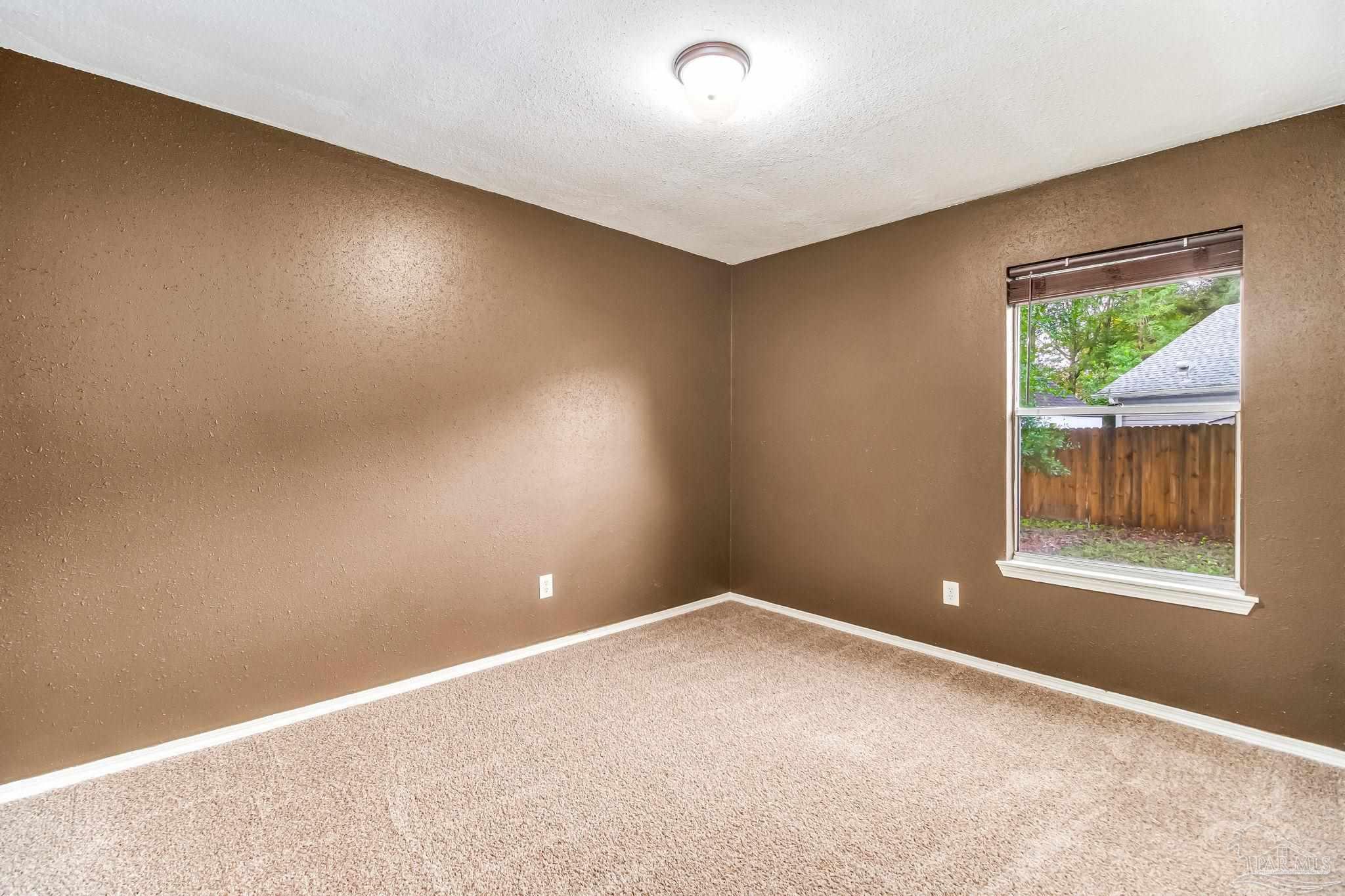 4554 Northpointe Place Pensacola, FL 32514 - Photo 27 of 42 an empty room with windows