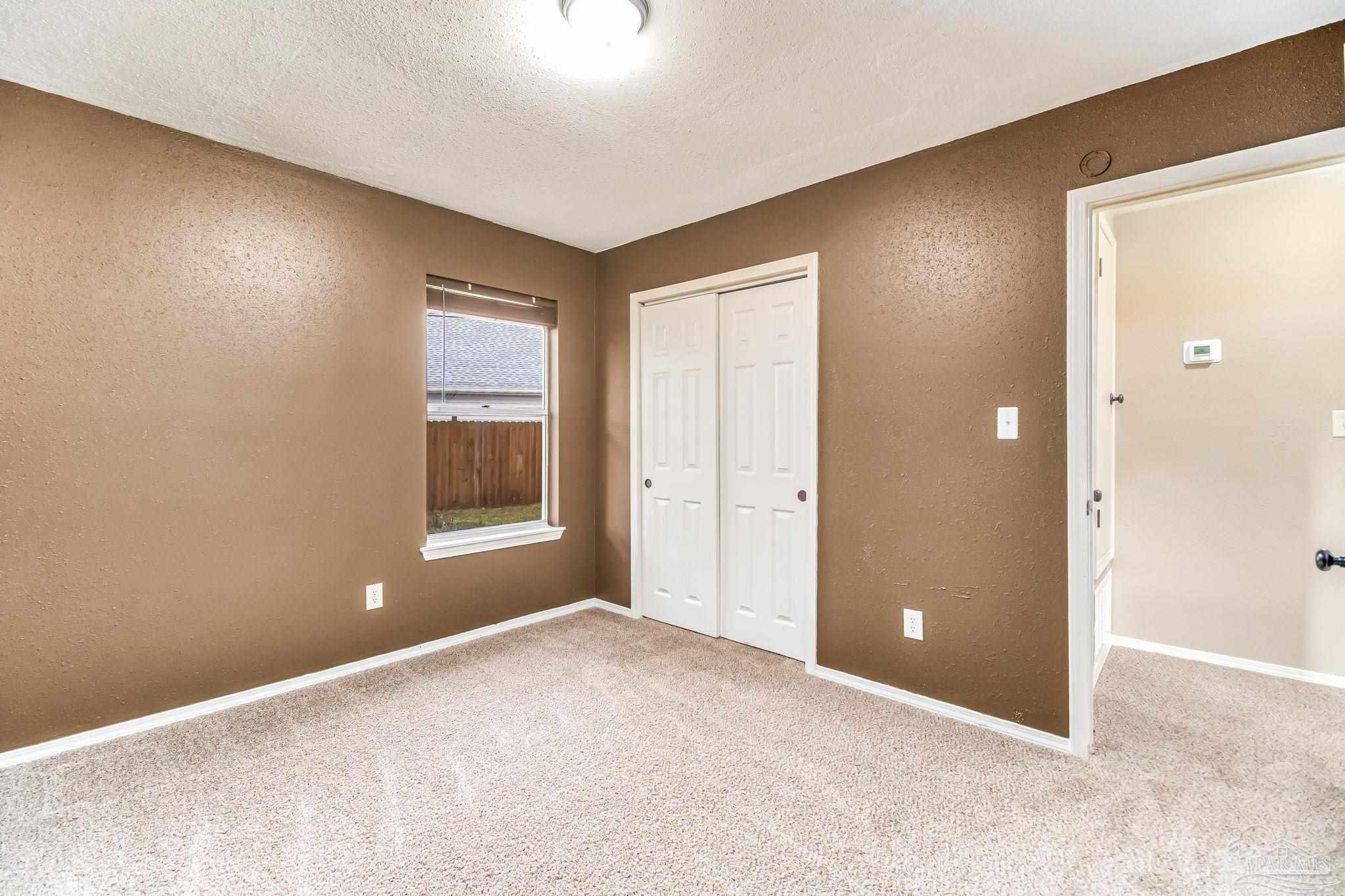 4554 Northpointe Place Pensacola, FL 32514 - Photo 28 of 42 a view of an empty room with a window