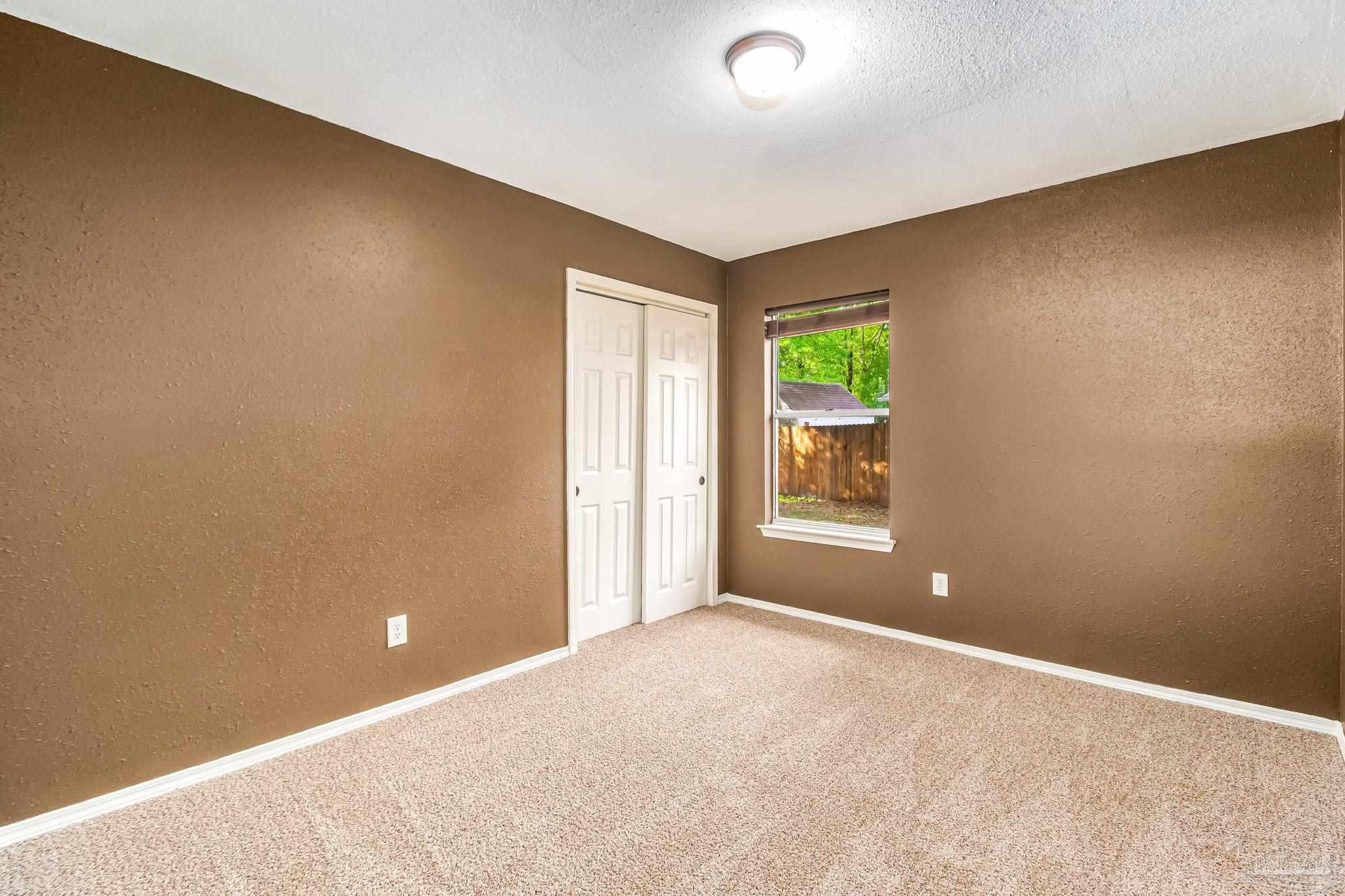 4554 Northpointe Place Pensacola, FL 32514 - Photo 32 of 42 a view of an empty room with a window