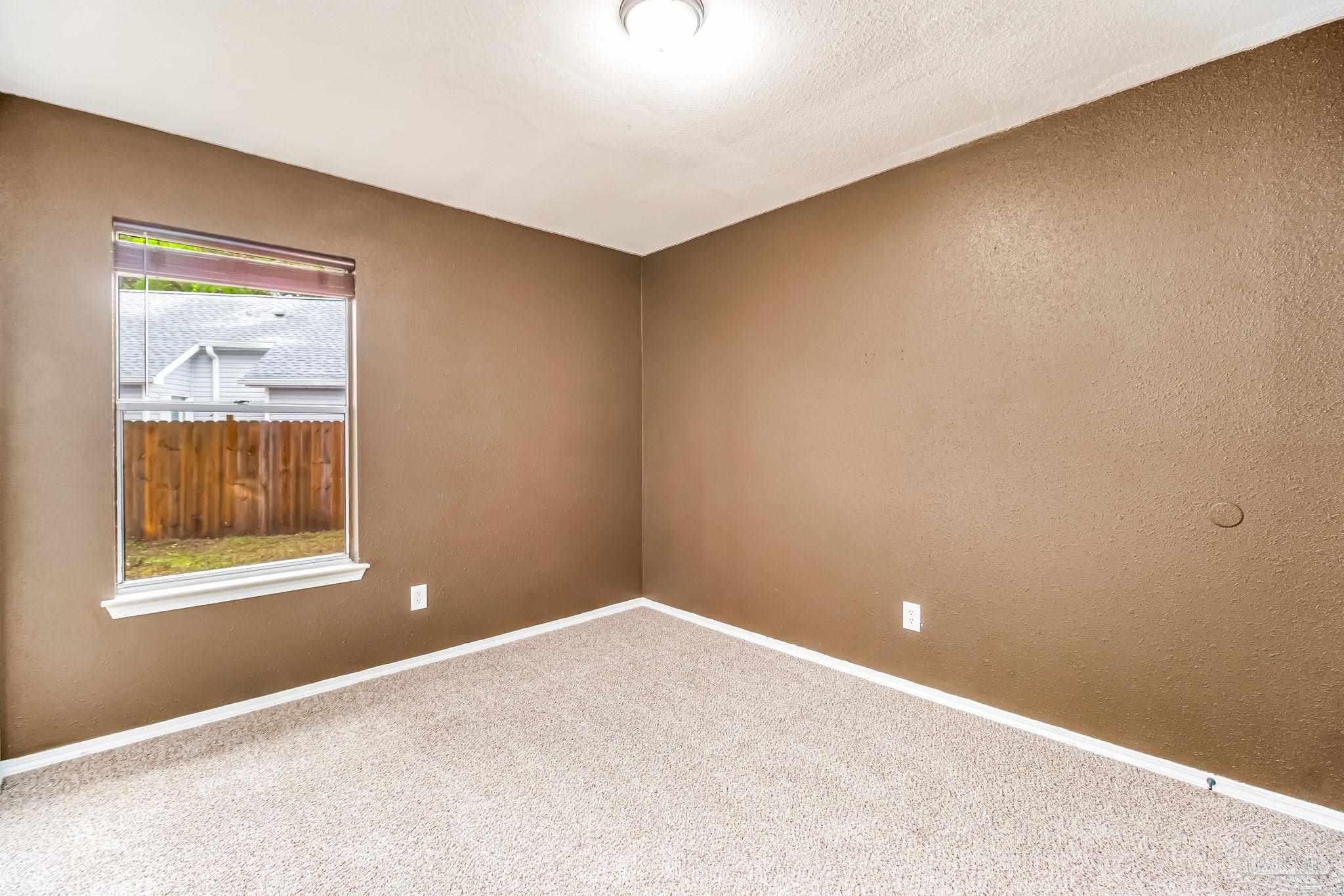4554 Northpointe Place Pensacola, FL 32514 - Photo 33 of 42 an empty room with a window