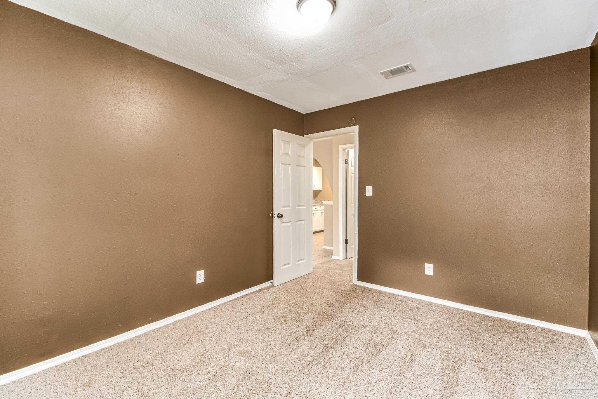 4554 Northpointe Place Pensacola, FL 32514 - Photo 34 of 42 a view of an empty room