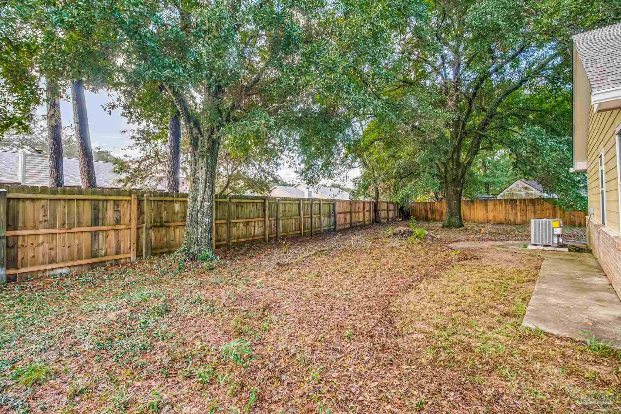 4554 Northpointe Place Pensacola, FL 32514 - Photo 37 of 42 a view of backyard with green space