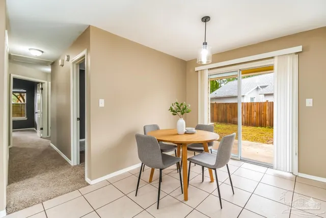 a view of a livingroom with a fireplace and fan