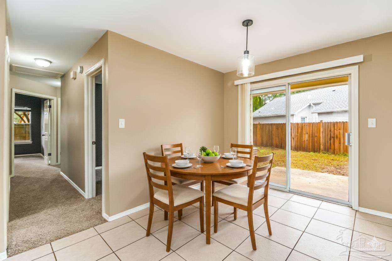 4554 Northpointe Place Pensacola, FL 32514 - Photo 6 of 42 a dining room with furniture and window