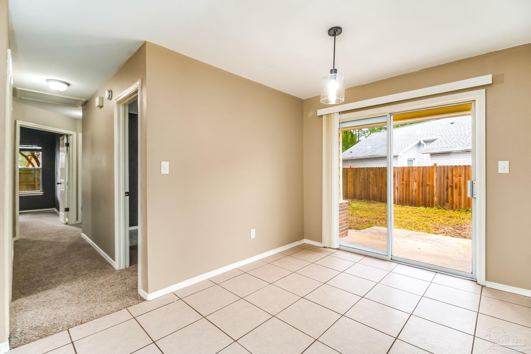 4554 Northpointe Place Pensacola, FL 32514 - Photo 7 of 42 a view of an empty room and window