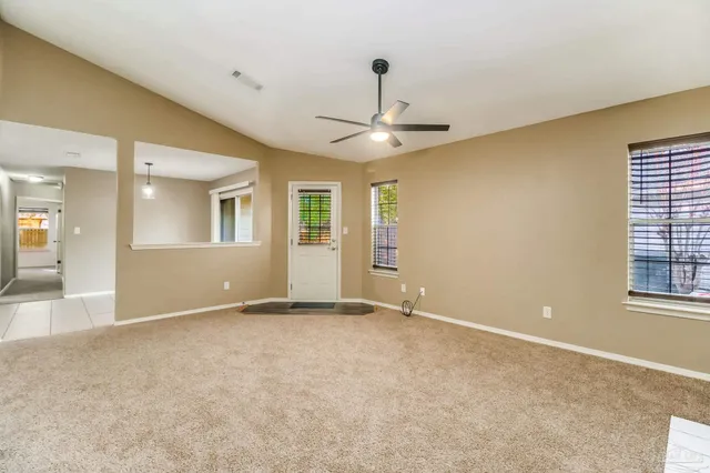 a view of a kitchen with kitchen appliances and cabinets