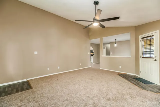 a kitchen with granite countertop cabinets stainless steel appliances and a counter space