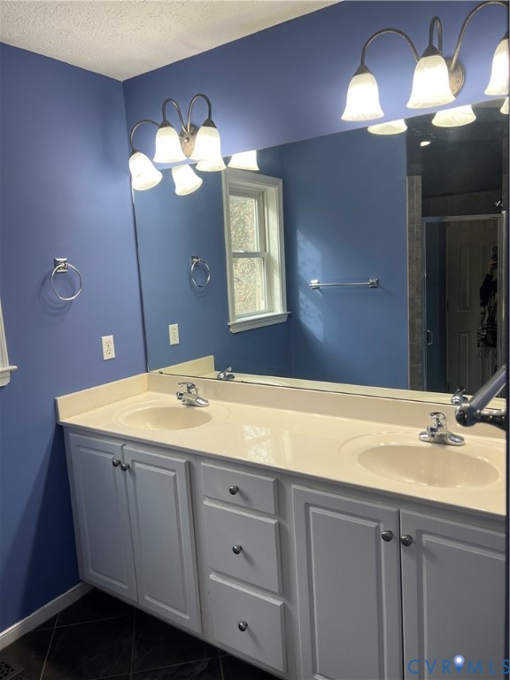 12960 Moody Road Hopewell, VA 23860 - Photo 21 of 33 Full bath with double vanity, a textured ceiling,