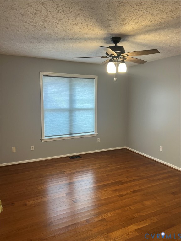 12960 Moody Road Hopewell, VA 23860 - Photo 32 of 33 Empty room featuring dark wood finished floors, a