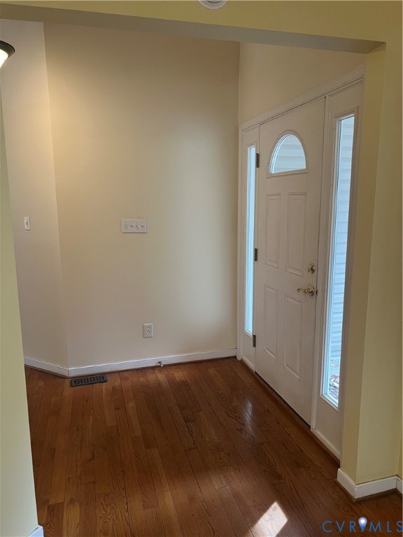 12960 Moody Road Hopewell, VA 23860 - Photo 5 of 33 Entryway with dark wood finished floors and basebo