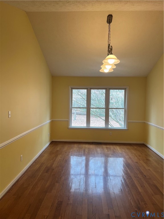 12960 Moody Road Hopewell, VA 23860 - Photo 7 of 33 Spare room featuring vaulted ceiling, hardwood / w