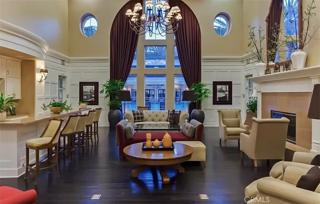 a view of a house with pool and sitting area