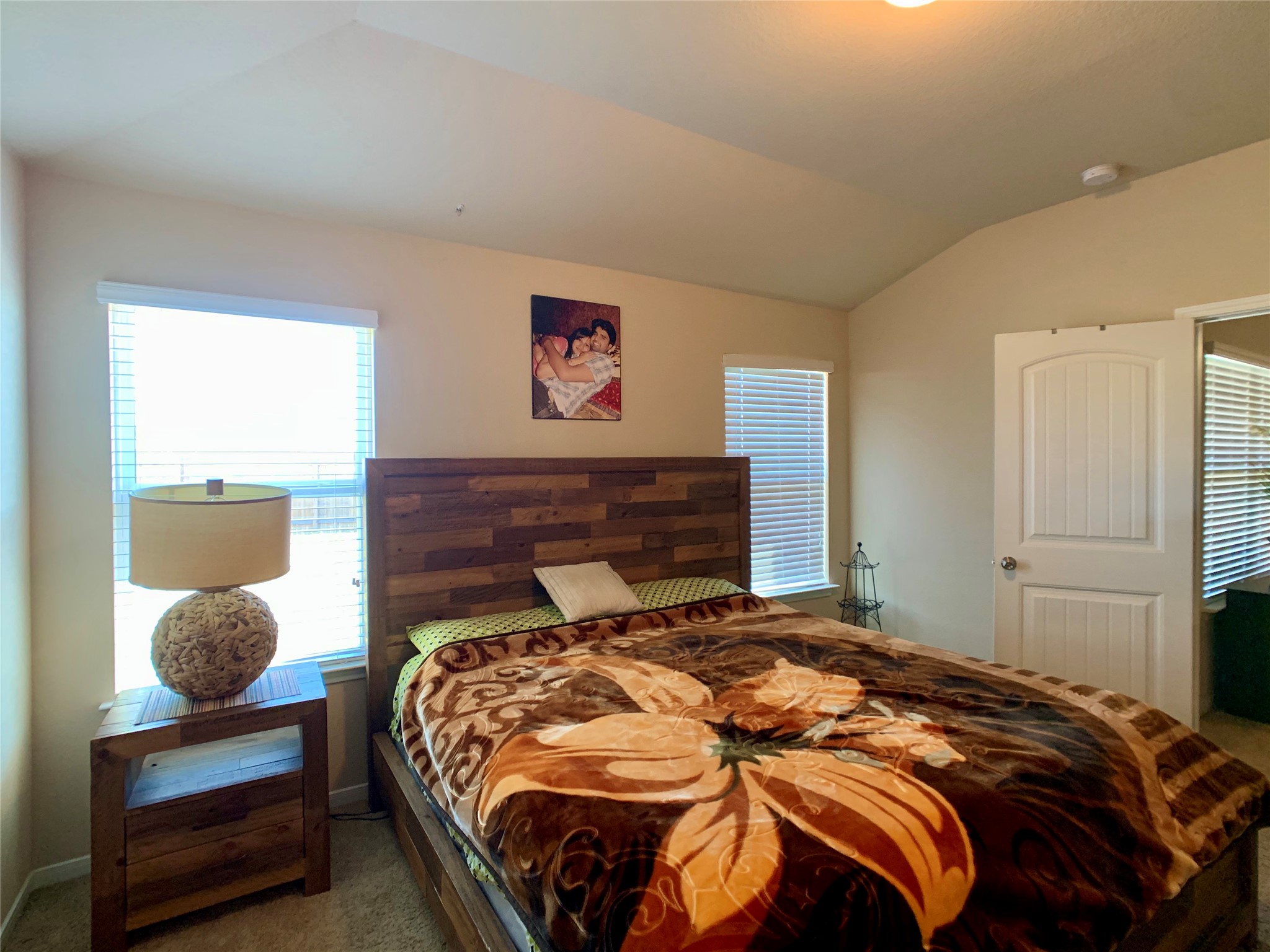5721 Roderick Drive Austin, TX 78724 - Photo 15 of 26 Carpeted bedroom featuring lofted ceiling and baseboards