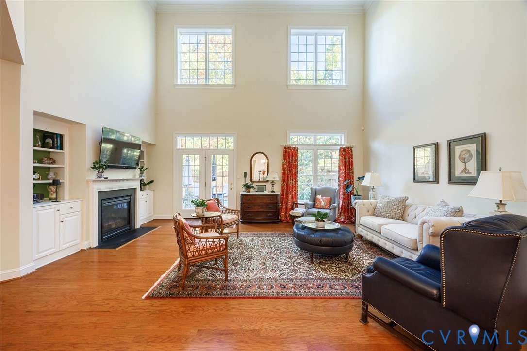 704 Chiswick Park Road Henrico, VA 23229 - Photo 12 of 47 a living room with fireplace furniture and a wooden floor