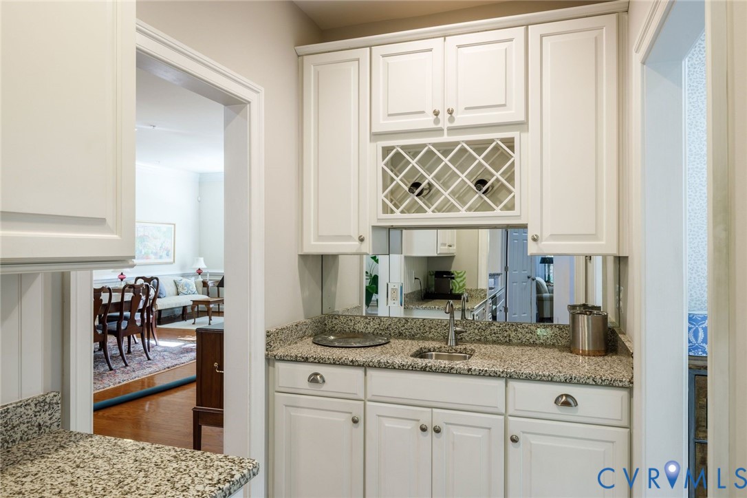 704 Chiswick Park Road Henrico, VA 23229 - Photo 18 of 47 a kitchen with white cabinets and a window