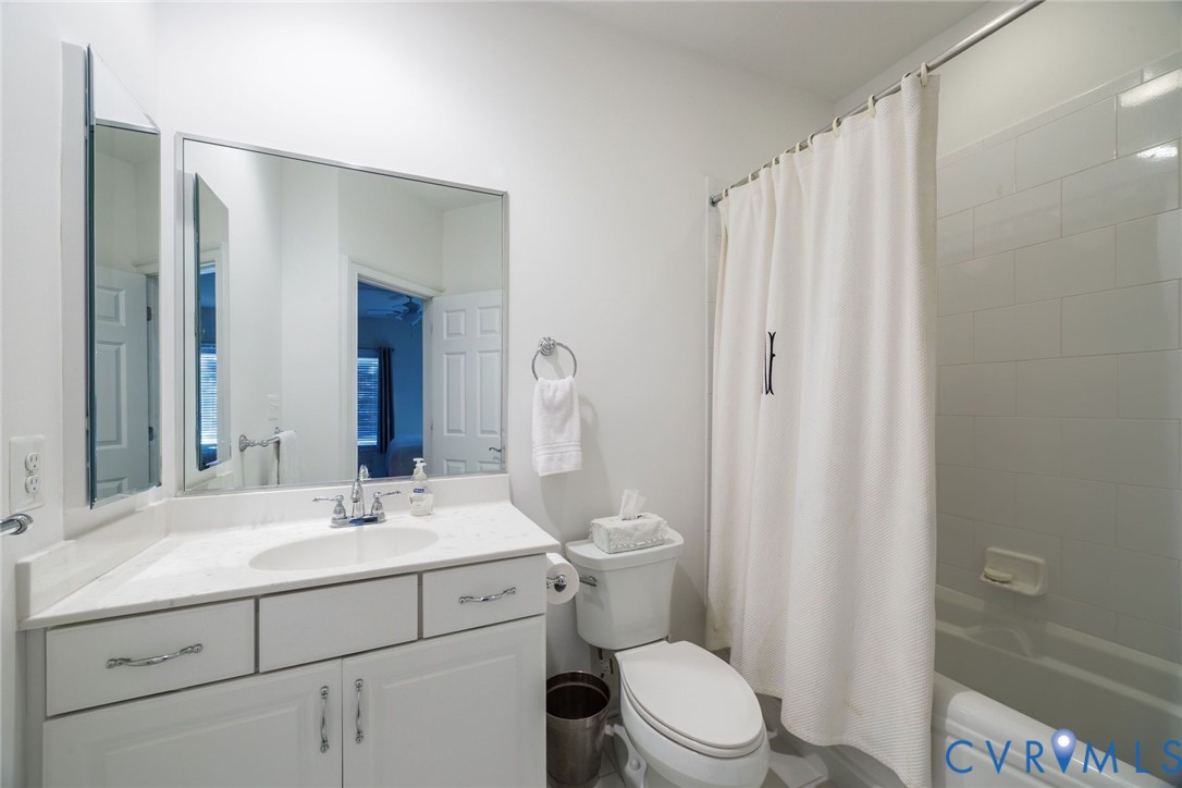 704 Chiswick Park Road Henrico, VA 23229 - Photo 30 of 47 a bathroom with a sink a toilet and shower