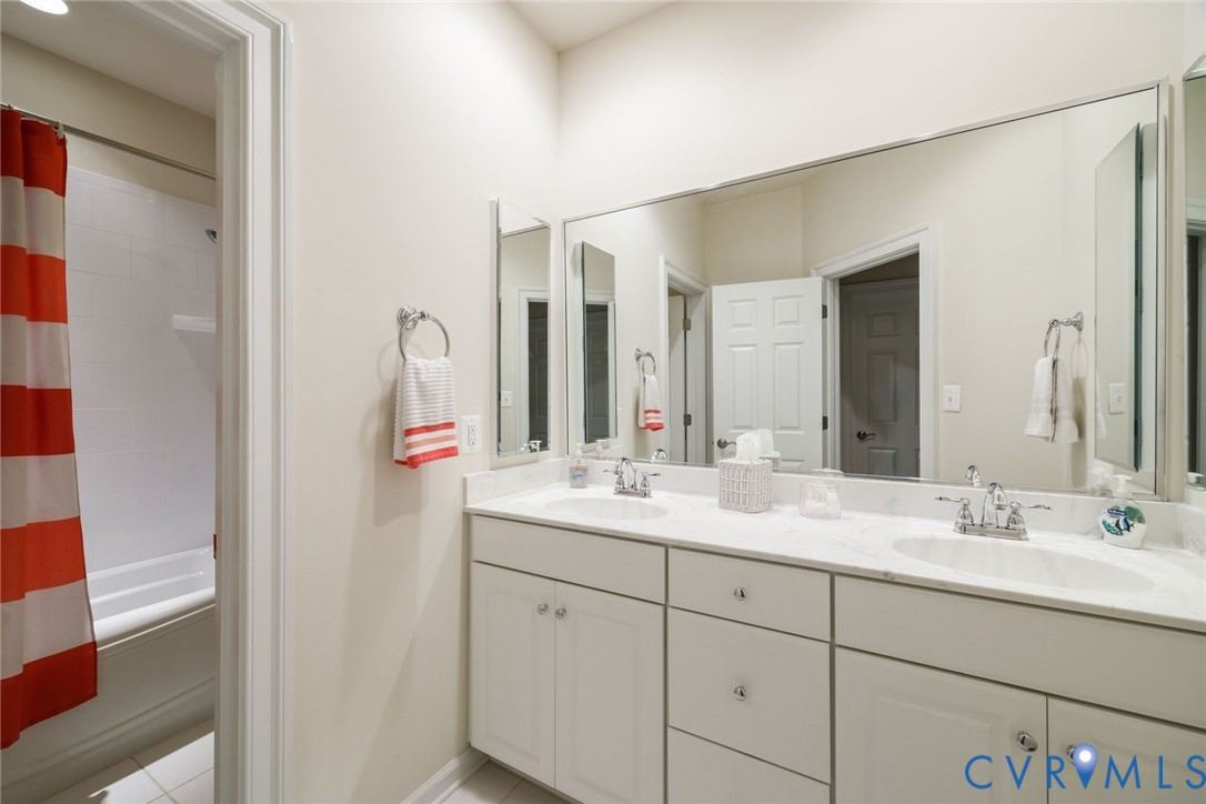 704 Chiswick Park Road Henrico, VA 23229 - Photo 32 of 47 a bathroom with a sink and a mirror