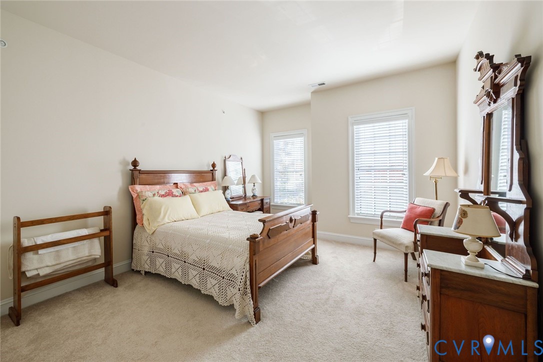 704 Chiswick Park Road Henrico, VA 23229 - Photo 33 of 47 a bedroom with a bed and a couch