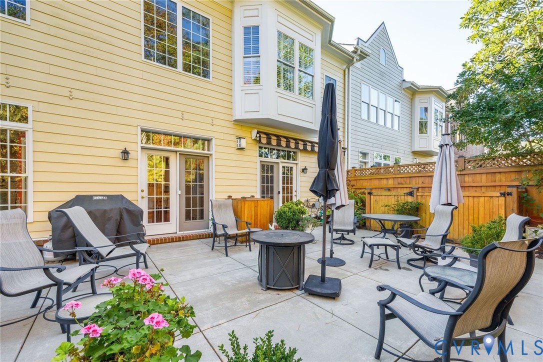 704 Chiswick Park Road Henrico, VA 23229 - Photo 34 of 47 a view of a patio with chairs and a table