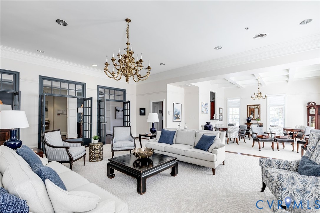 704 Chiswick Park Road Henrico, VA 23229 - Photo 43 of 47 a living room with furniture and a chandelier