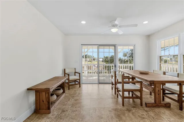 a room with furniture and large windows