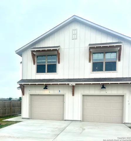 a front view of a house with large windows