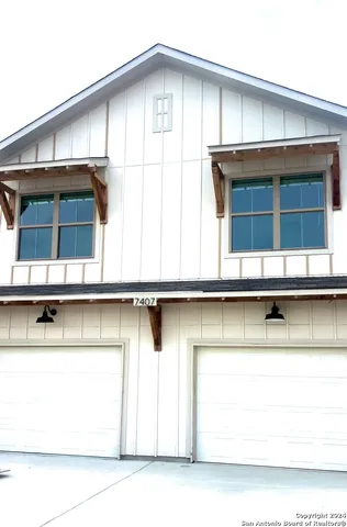 a front view of a house with garage