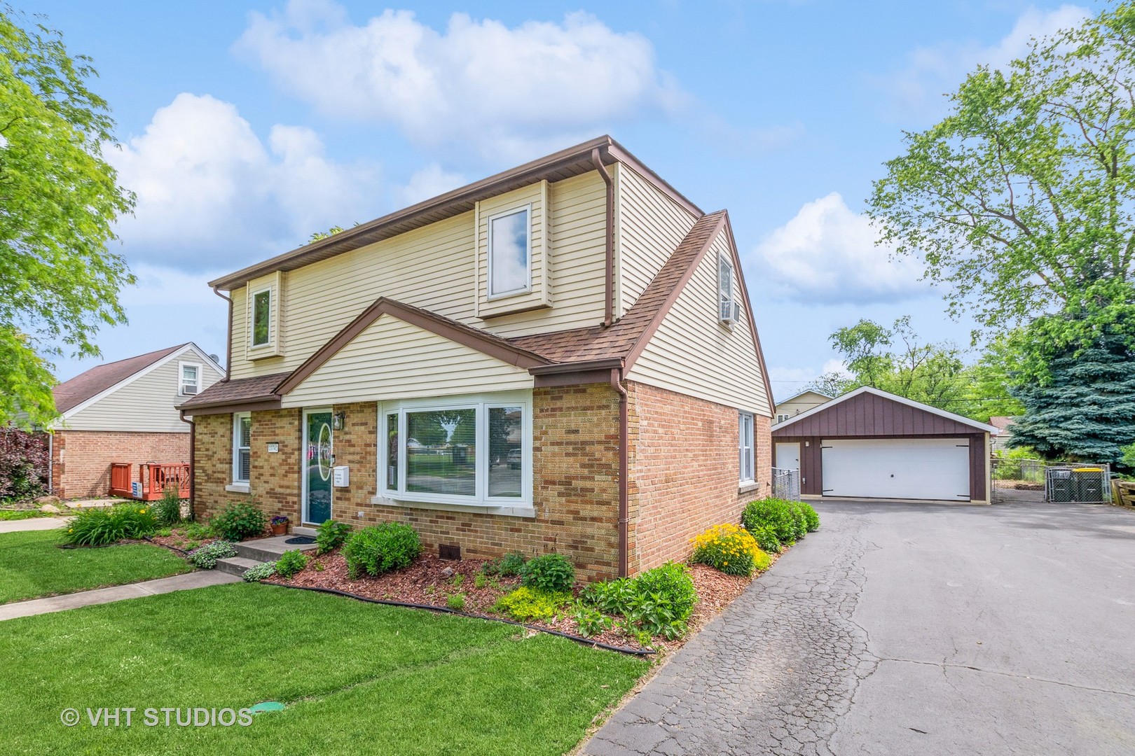 10743 Lombard Avenue Chicago Ridge, IL 60415 - Photo 2 of 20 a front view of a house with a garden and deck