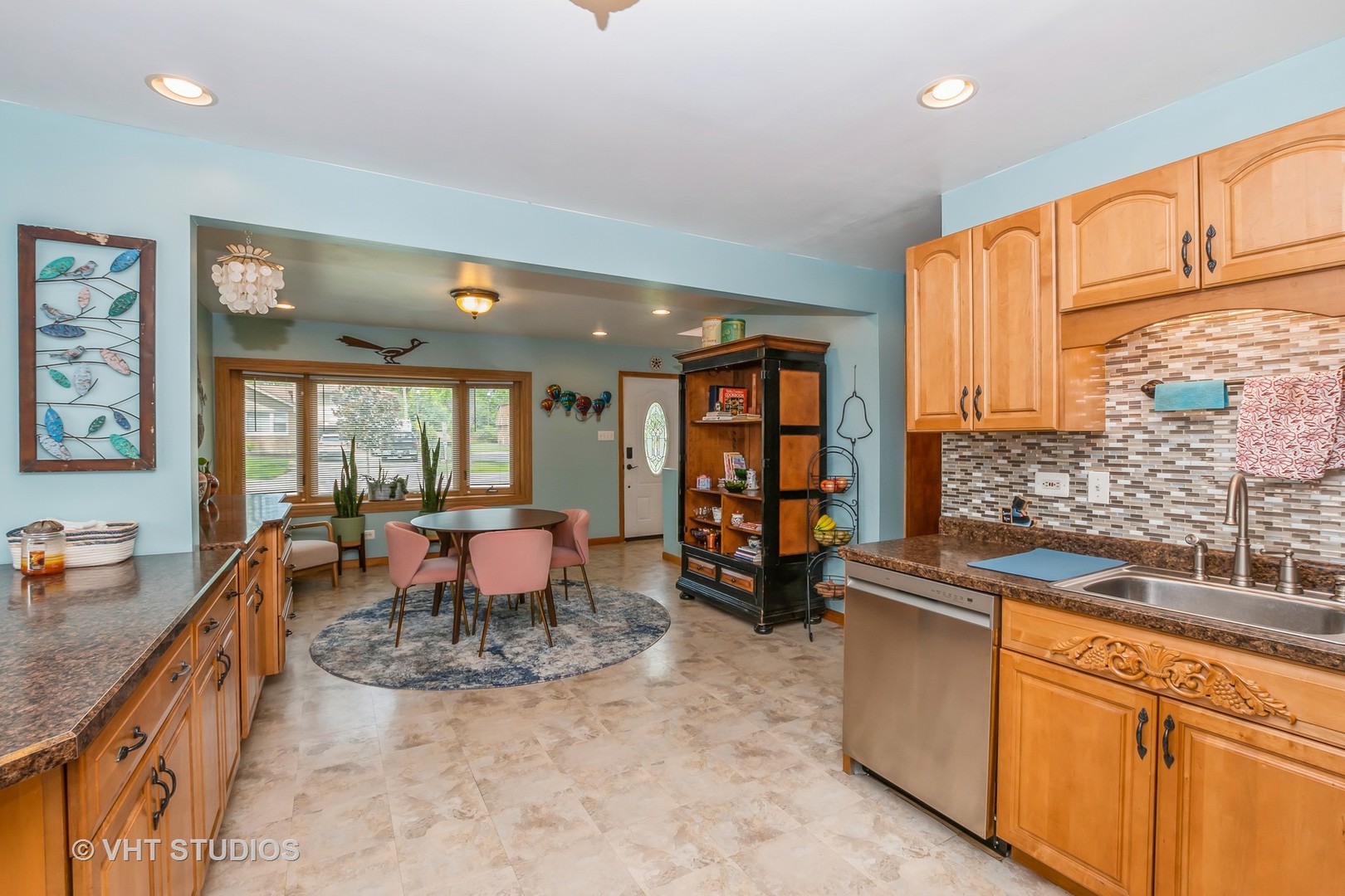 10743 Lombard Avenue Chicago Ridge, IL 60415 - Photo 3 of 20 a dining hall with stainless steel appliances granite countertop a sink a stove and a refrigerator