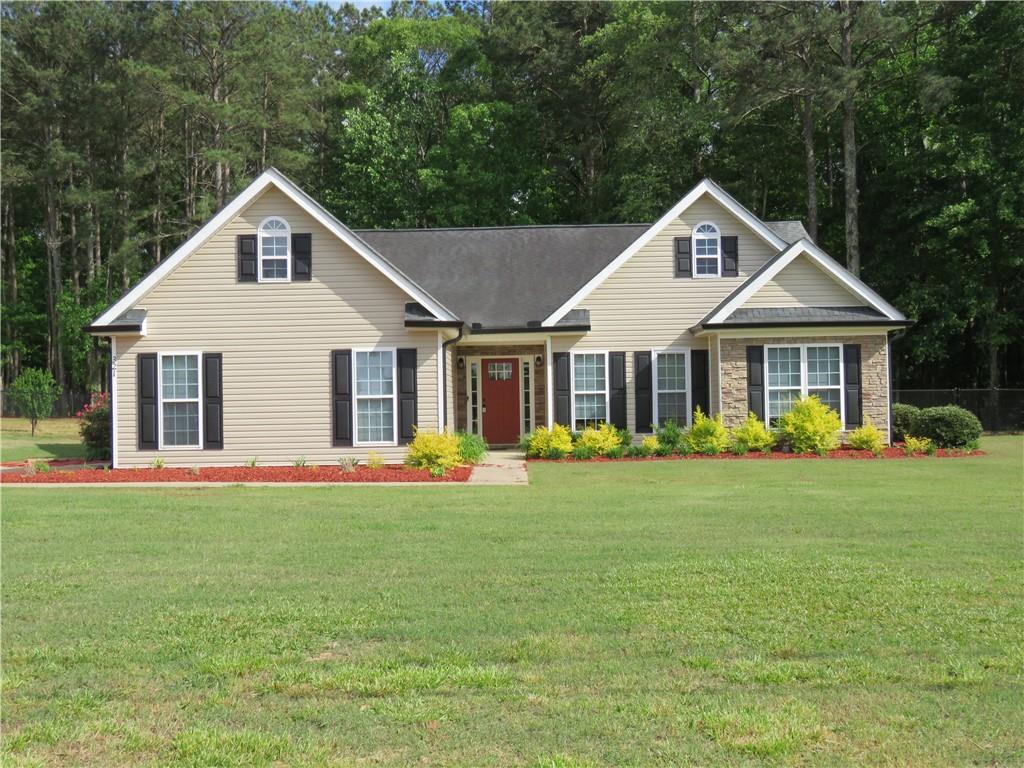 321 Sandhill Hulett Road Villa Rica, GA 30180 - Photo 1 of 1 a front view of a house with a yard and trees