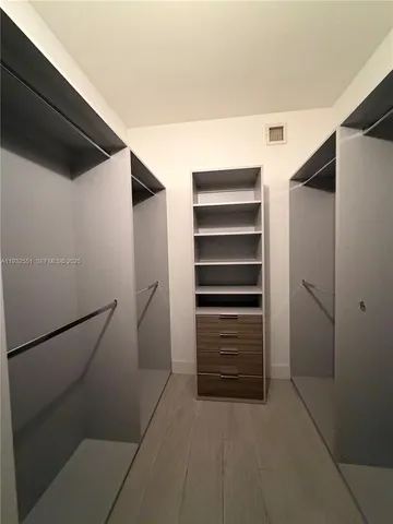 a bathroom with a bathtub a sink a toilet and a mirror