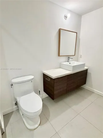 a view of a swimming pool with outdoor seating