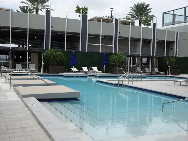 a view of a patio with a table and chairs